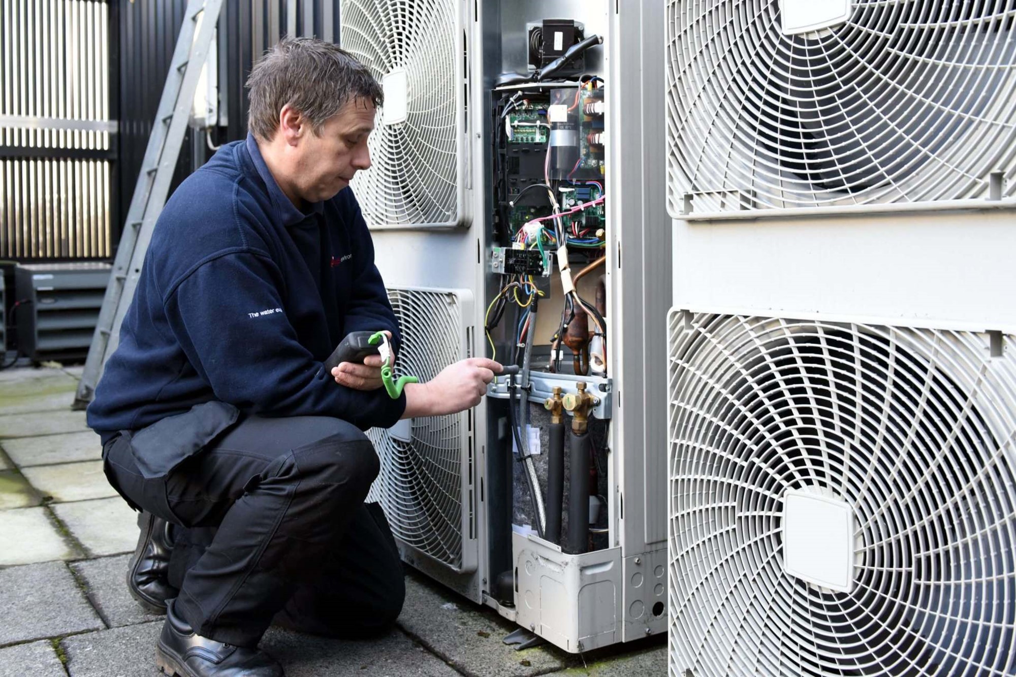 A SMS Environmental engineer servicing HVAC Air Handling systems maintenance